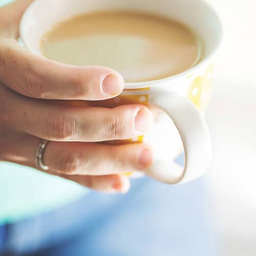 Mug of creamy keto coffee with frothy foam on top