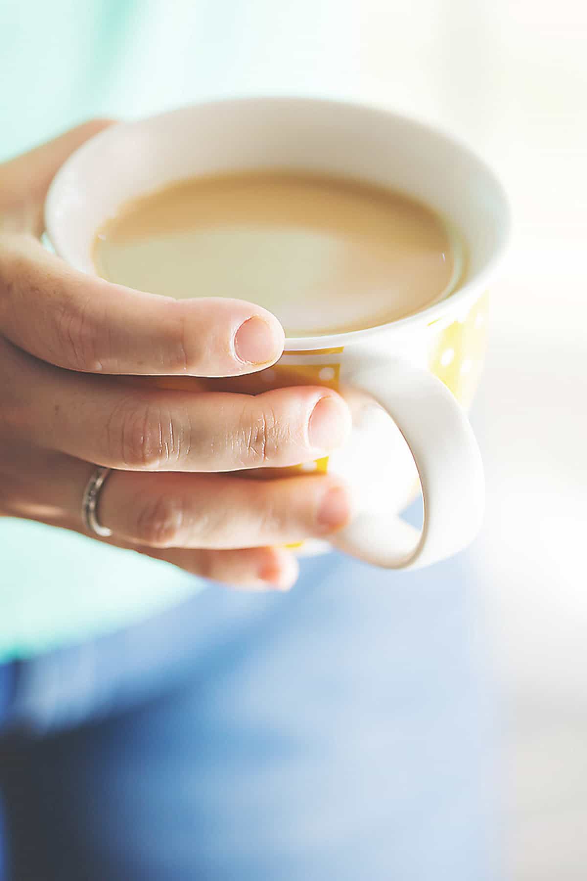 Mug of creamy keto coffee with frothy foam on top