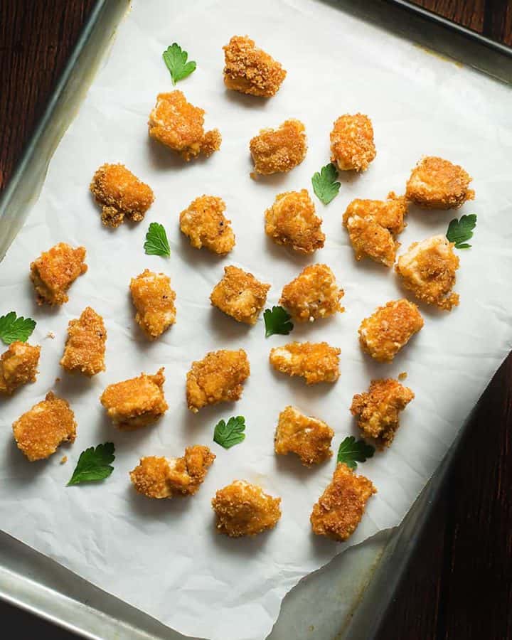 pork rind chicken nuggets baked on a sheet pan