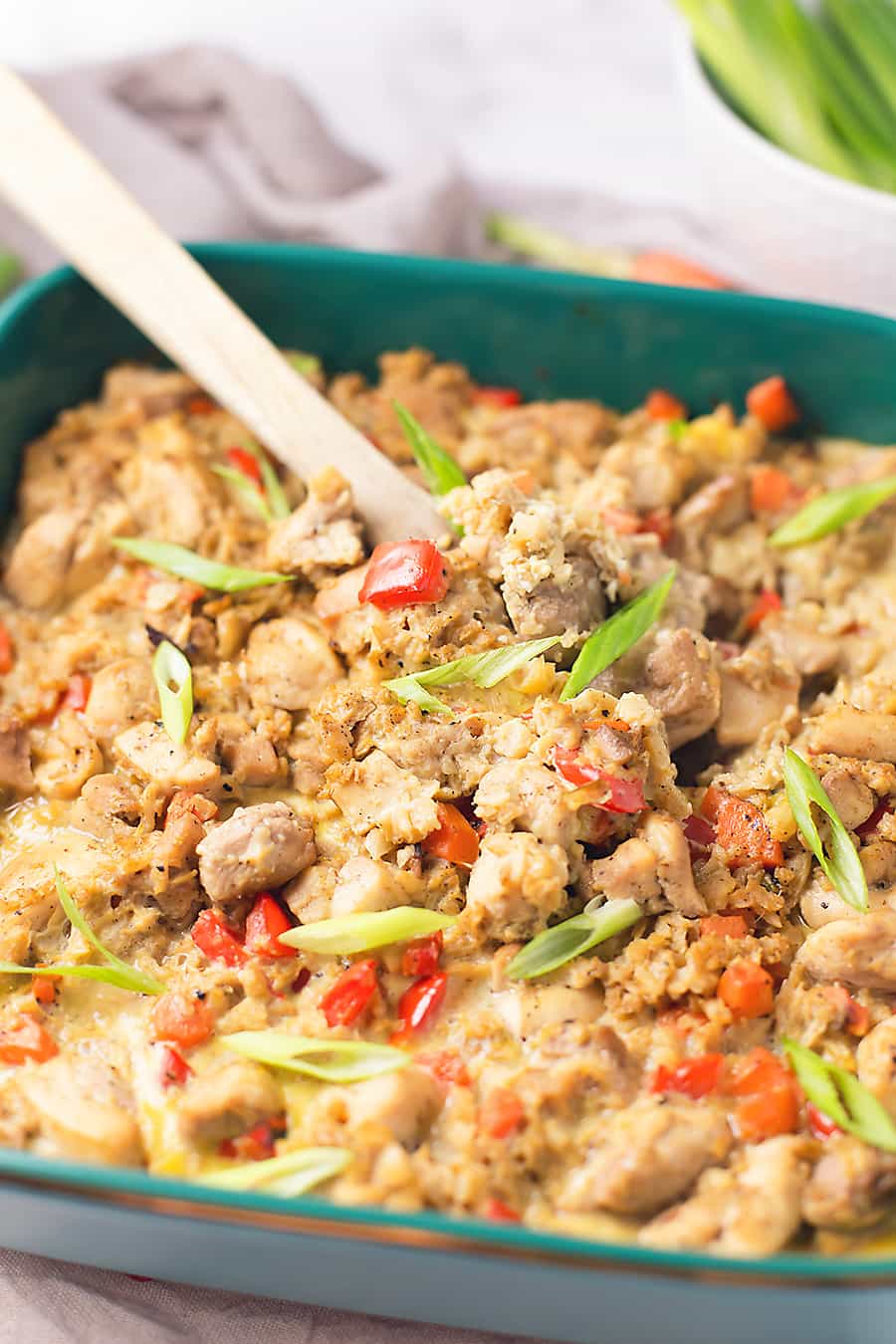 This chicken cauliflower fried rice casserole is like comfort Chinese food but without all of the carbs! This casserole is full of veggies but your kids will never know that it is cauliflower instead of white rice! Feel free to fill your plate with this low carb chicken cauliflower fried rice casserole