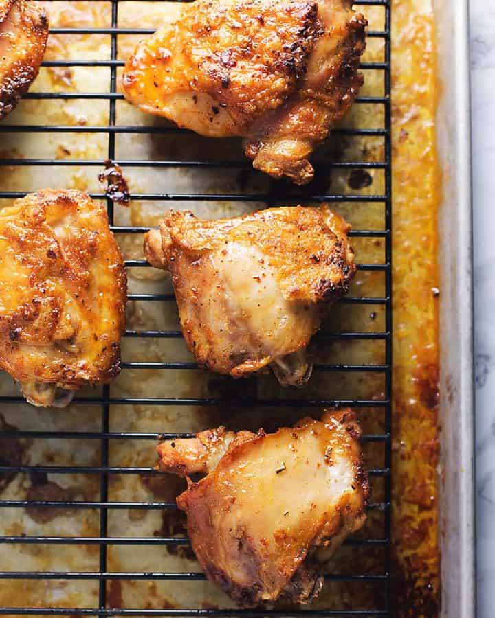 crispy chicken thighs recipe on a baking rack