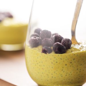 chia pudding in glass cups with frozen blueberries