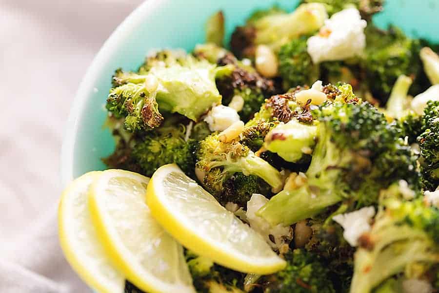 low carb broccoli salad in a bowl with lemon slices