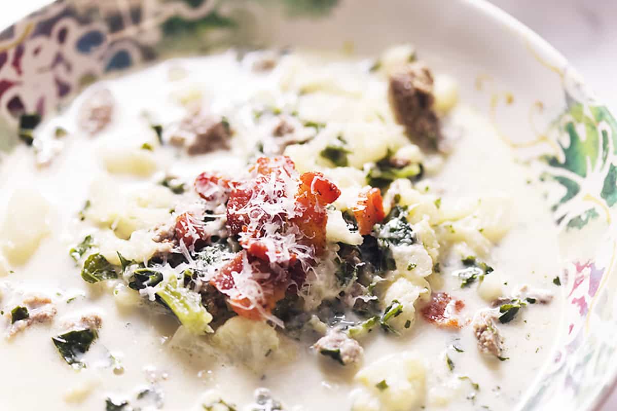 a bowl of Zuppa Toscana with crispy bacon on top