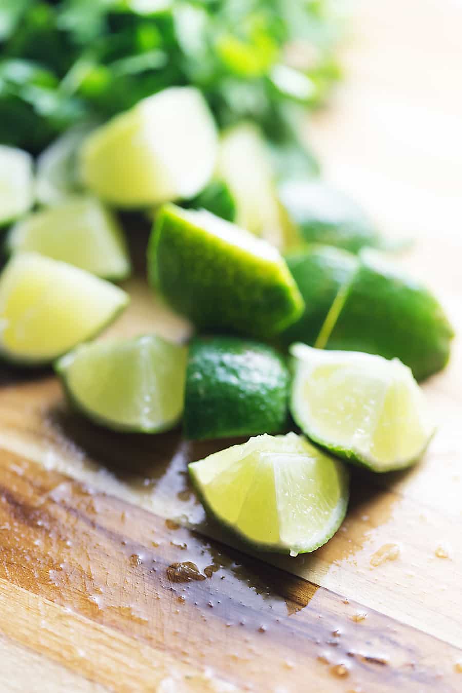 limes cut on a cutting board for low carb salad dressing
