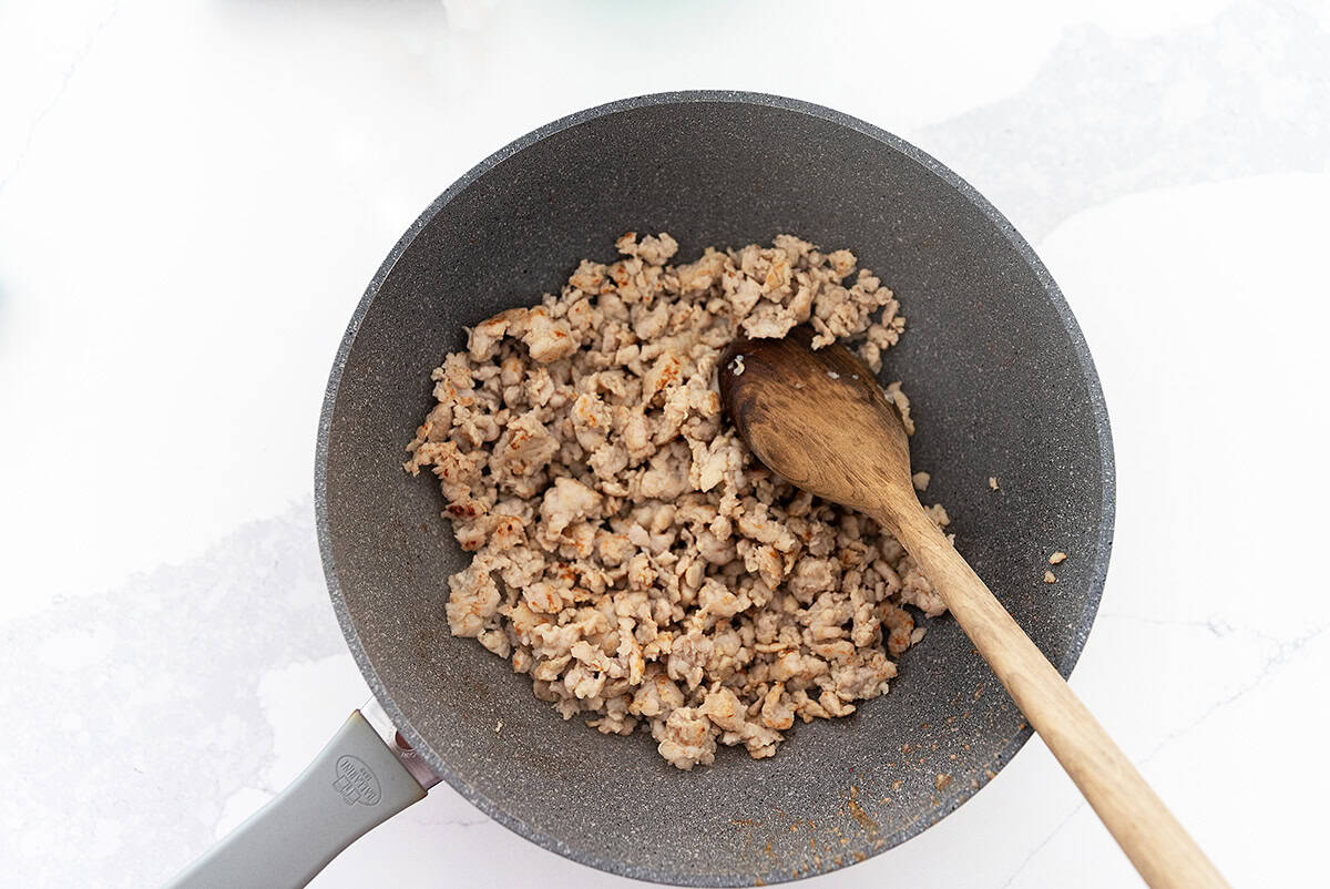 cooked and crumbled sausage in a skillet
