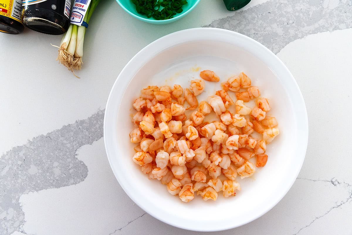 cooked chunks of shrimp in a white plate