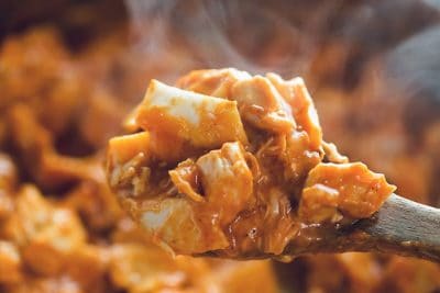 keto chicken enchiladas skillet in a serving spoon