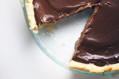 a sugar free chocolate pie with a piece taken out