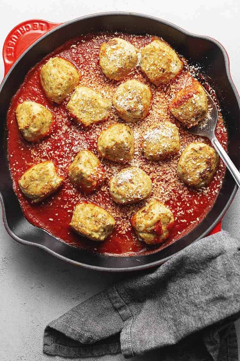 Chicken Parmesan Meatballs in a cast iron skillet