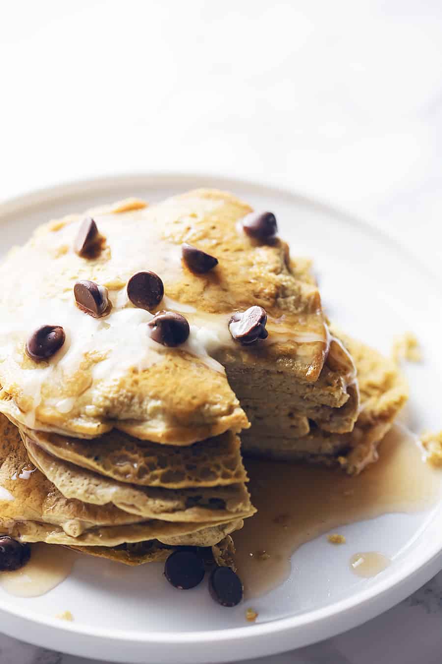 a stack of protein pancakes on a white plate