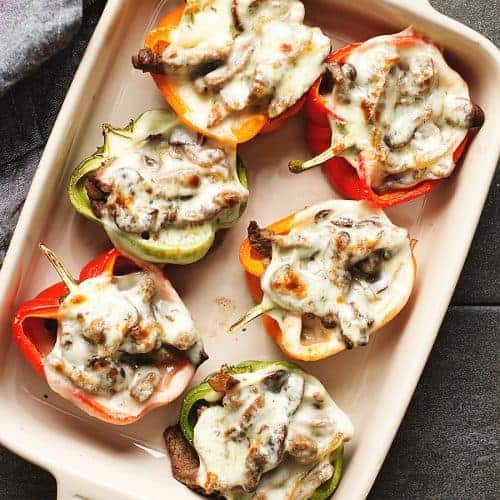 philly cheesesteak stuffed peppers in a baking dish