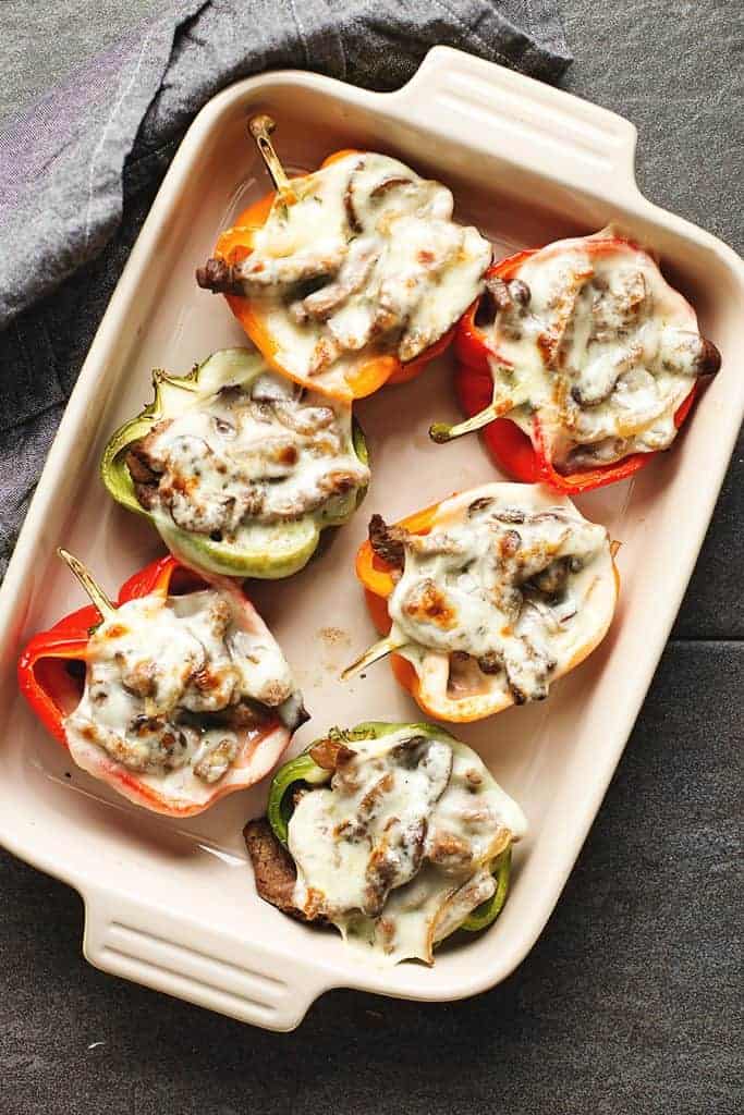 philly cheesesteak stuffed peppers in a baking dish