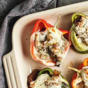 philly cheesesteak stuffed peppers in a casserole dish