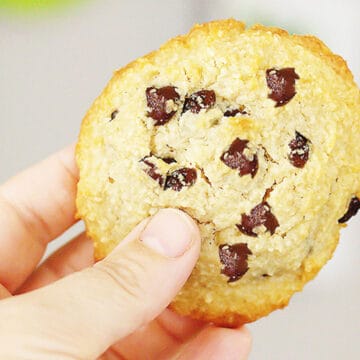 holding a chocolate chip cookie