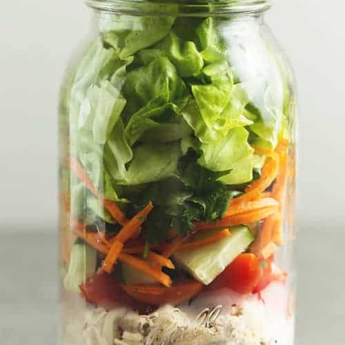 a mason jar with salad in it