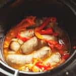 cooked sausage and peppers in a slow cooker