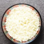 frozen cauliflower rice in a microwave safe bowl
