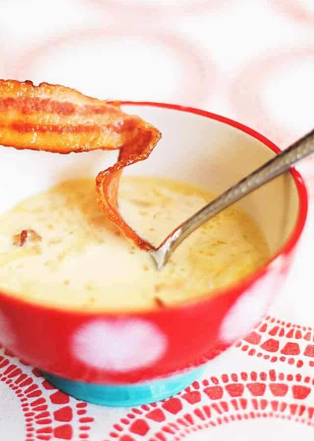 cream of cauliflower soup in a red bowl