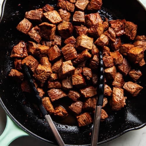 steak tips cooked in a skillet