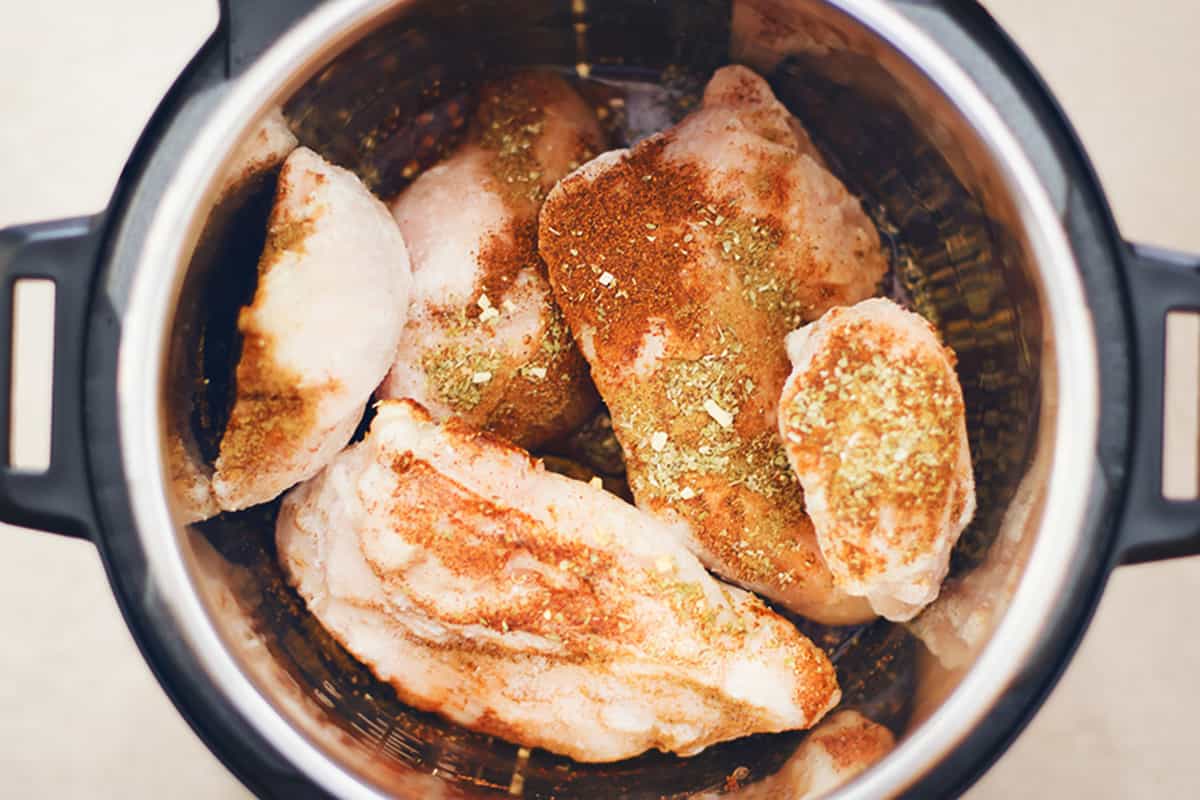 frozen chicken and seasonings in an instant pot