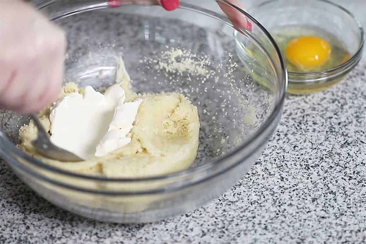 cream cheese being mixed into fathead dough