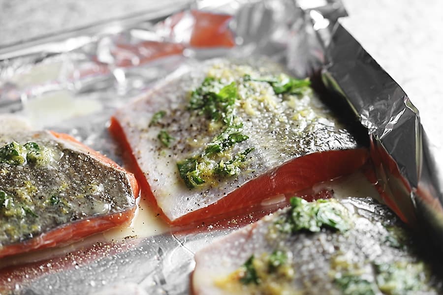 baked salmon on a foil lined tray