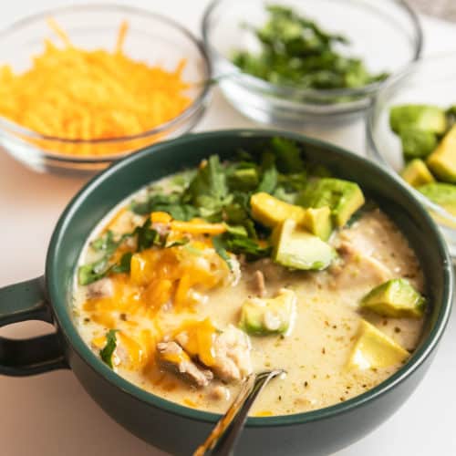 keto white chicken chili in a green bowl