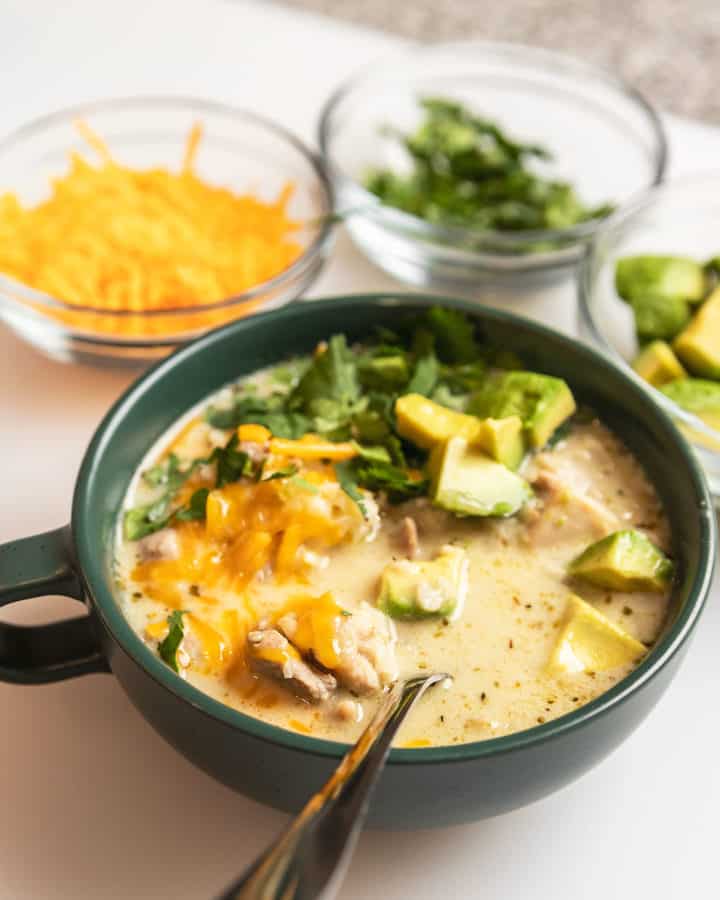 keto white chicken chili in a green bowl