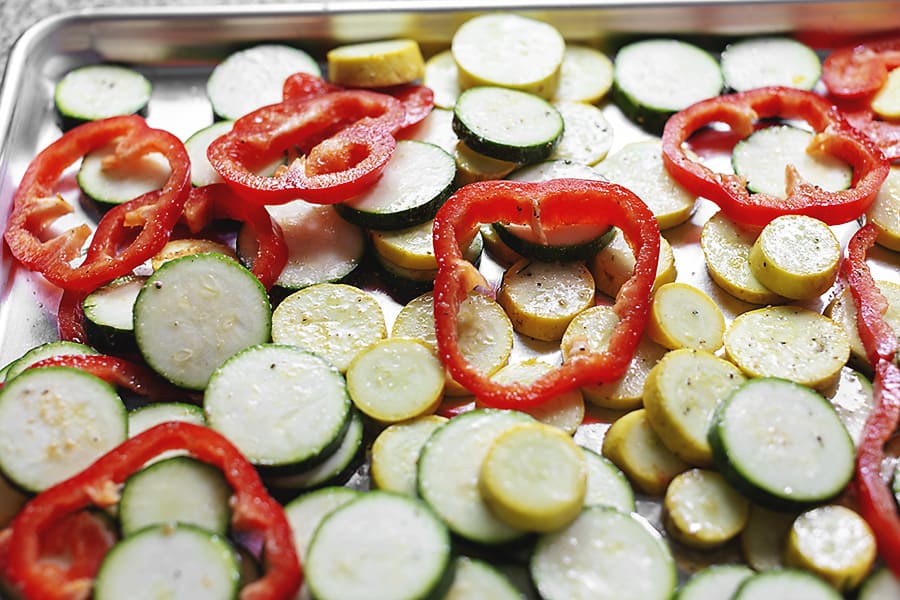 green and red veggies on a sheet pan