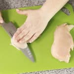 chicken being sliced in half