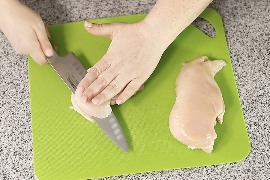 cutting a chicken breast in half