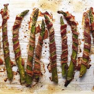 bacon wrapped asparagus on a sheet pan