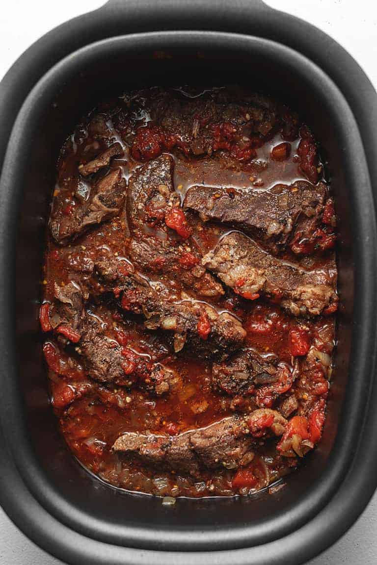 crockpot short ribs in a slow cooker