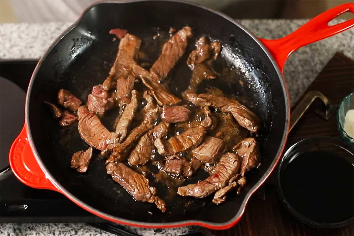cooked steak strips in a skillet