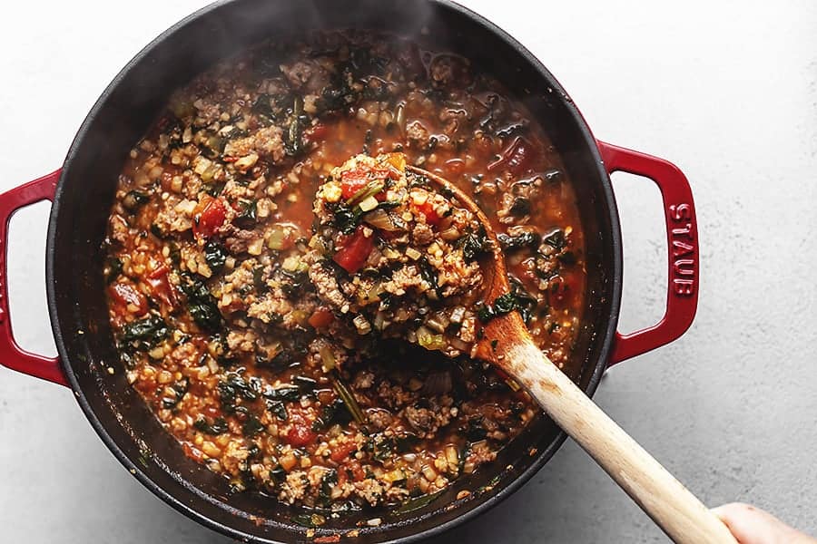 italian vegetable stew in a red pot