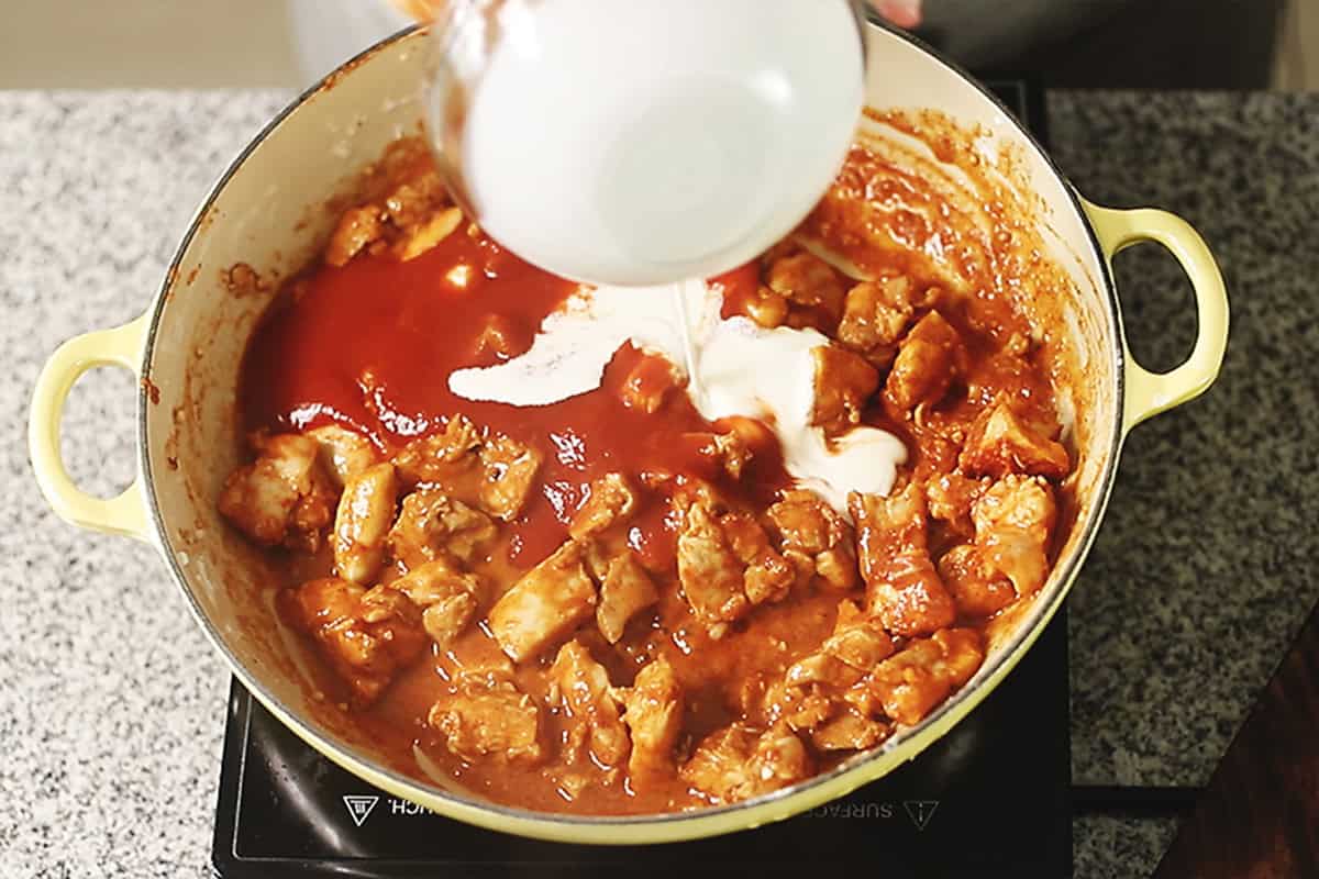 adding sauce ingredients to keto butter chicken