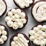 keto buttercream frosting cupcakes on a white platter