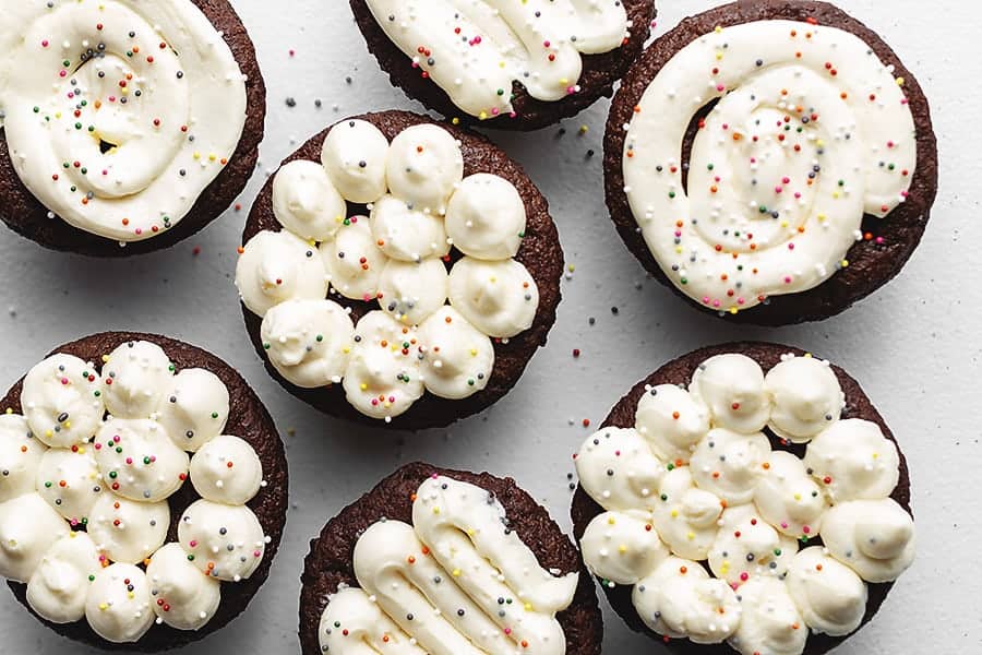 keto buttercream frosting cupcakes on a white platter