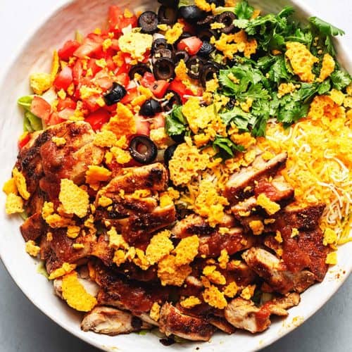 taco salad with chicken in a white bowl