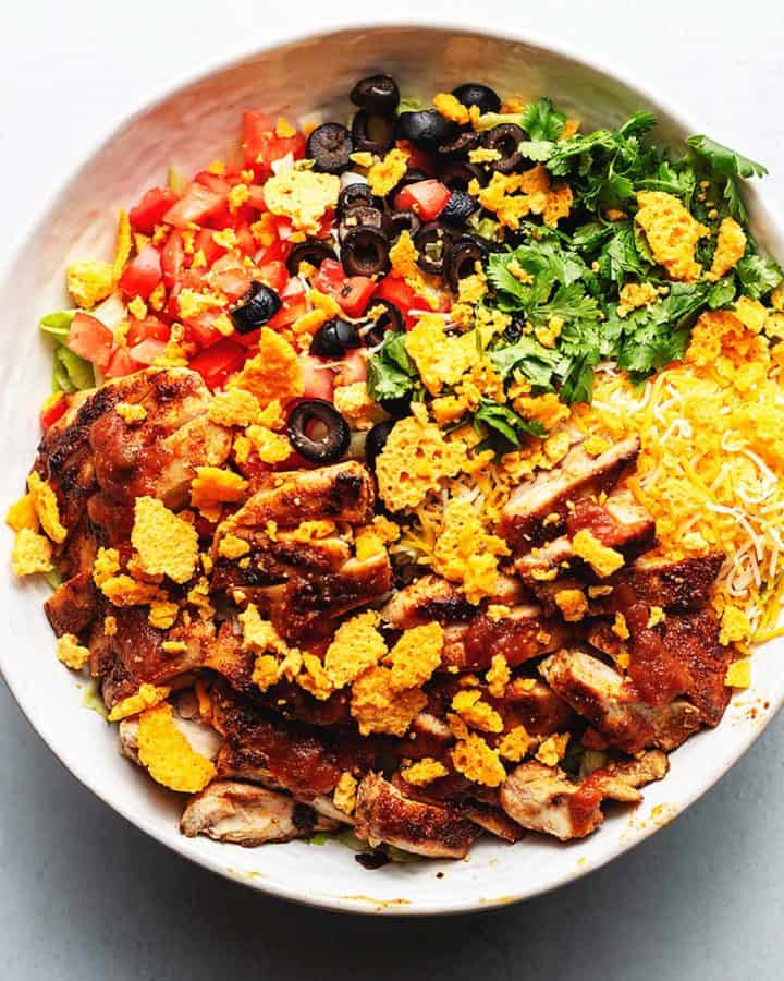 taco salad with chicken in a white bowl