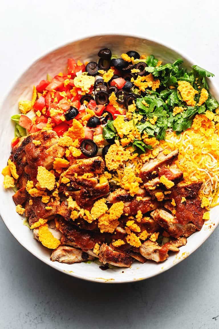 taco salad with chicken in a white bowl