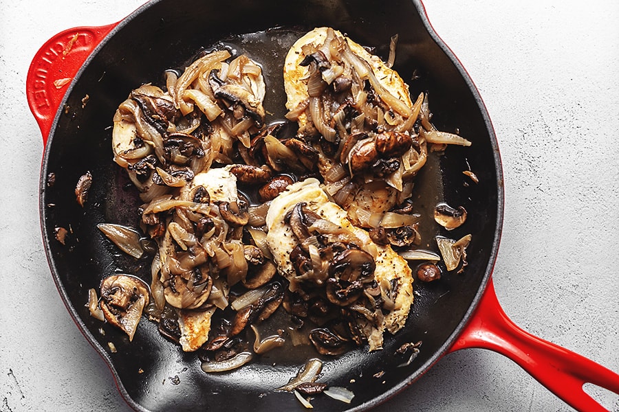 French onion smothered chicken in a skillet