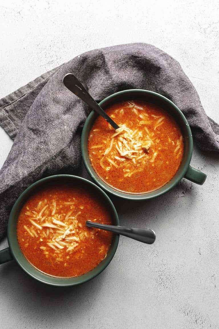chicken enchilada soup in green bowls