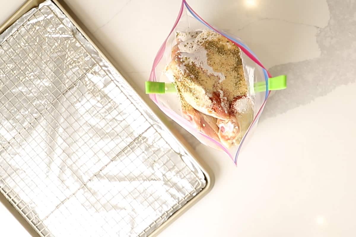chicken thighs in a zip top bag with seasonings