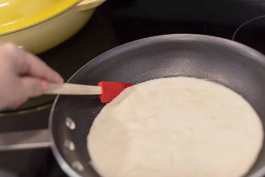 keto crepes being cooked in a skillet