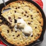 keto skillet chocolate chip cookie fresh out of the oven in a skillet