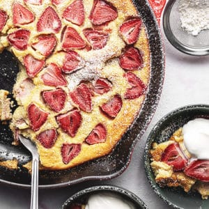 keto strawberry clafoutis in a cast iron skillet