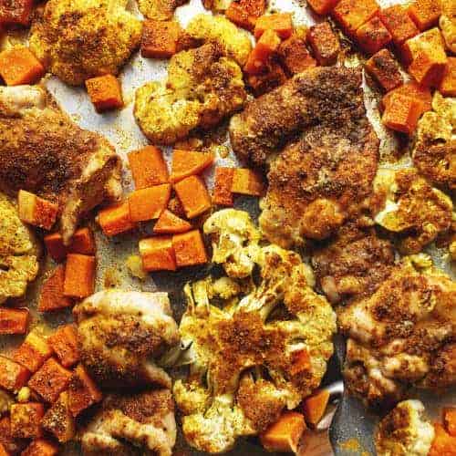 chicken thighs and veggies on a sheet pan