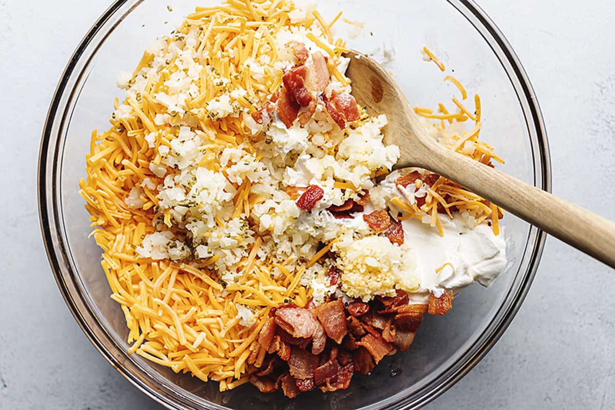 ingredients for cauliflower casserole in a glass bowl